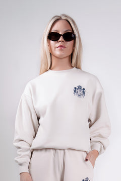 Quiet luxury crest crewneck in cream by Thorne Estate