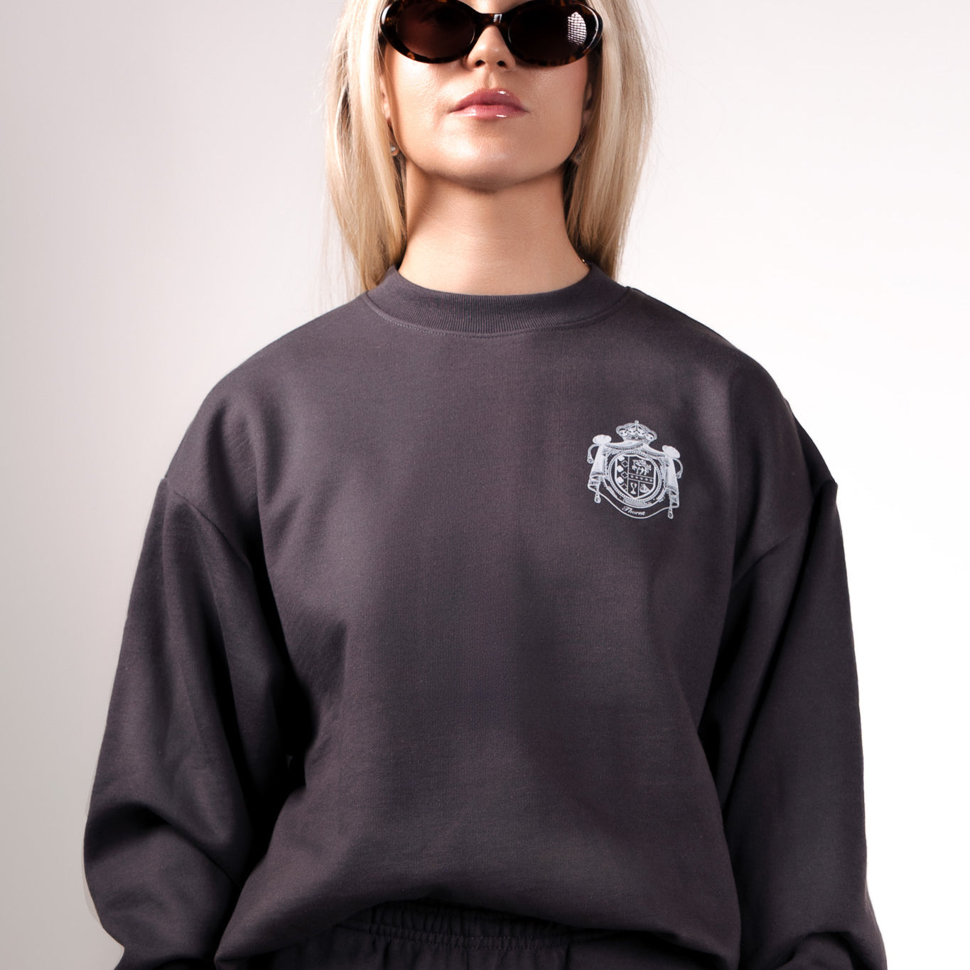 Quiet luxury crest crewneck in gray by Thorne Estate