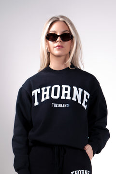 Quiet luxury varsity crewneck in navy by Thorne Estate