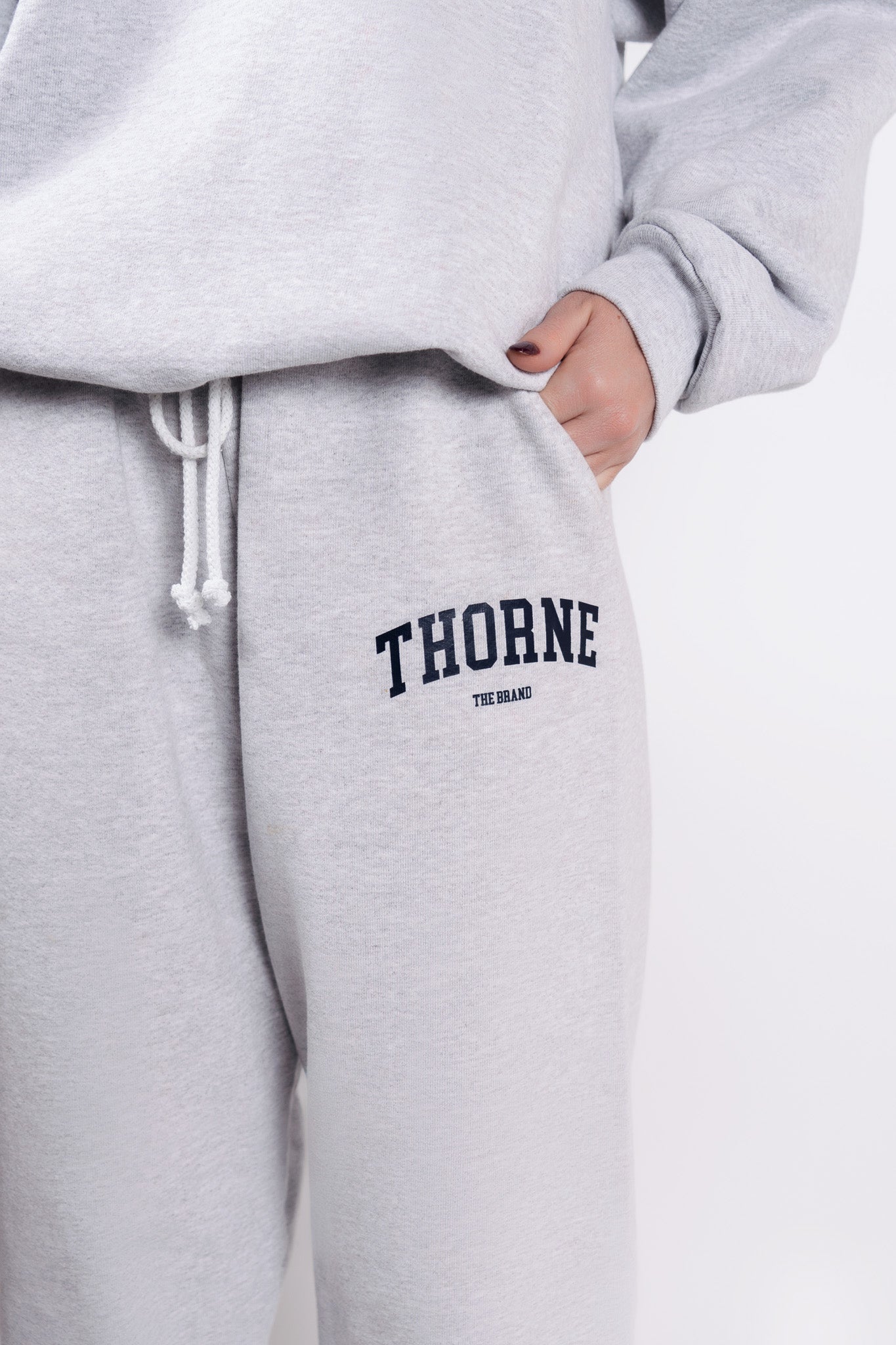 Close-up detail of Thorne Estate varsity logo in gray
