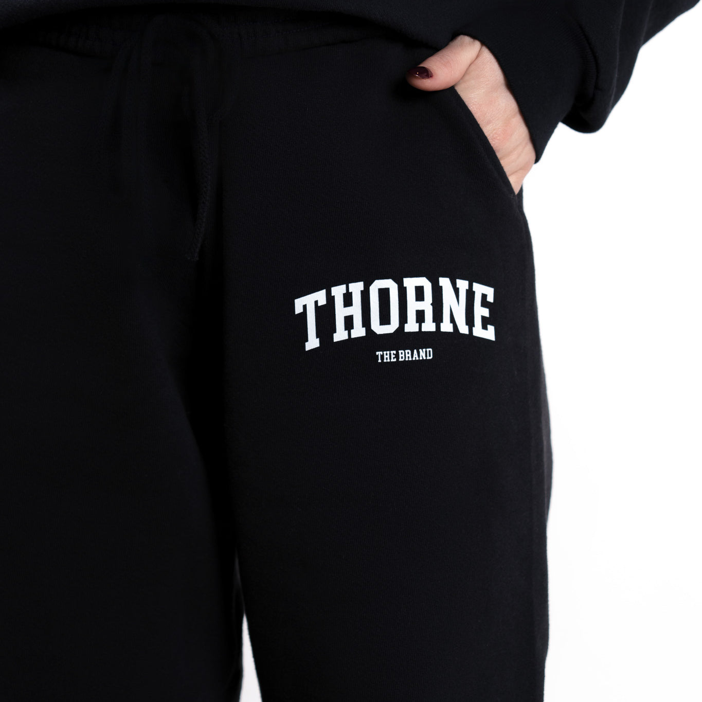 Close-up detail of Thorne Estate varsity sweatpant logo