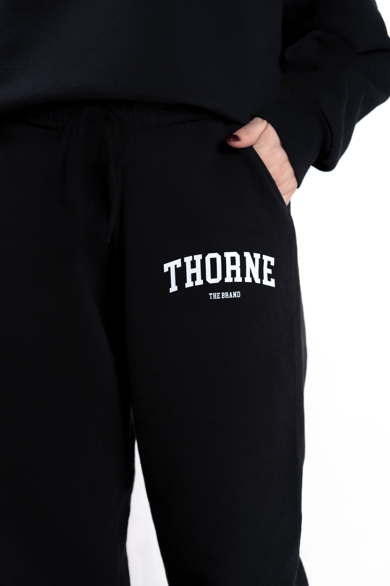 Close-up detail of Thorne Estate varsity sweatpant logo